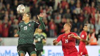 Ismail Ahmed Mohamed, left, pursued by Kyrgyzstan's Vitalij Lux.