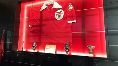 A giant replica version of the club’s 1960s shirt fills one of the walls in the Benfica boardroom. Courtesy Andy Mitten