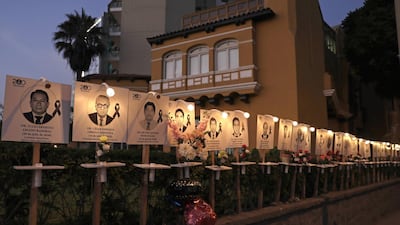Photos of health workers who died with COVID-19 are displayed on the boardwalk of the Miraflores district in Lima, Peru. EPA