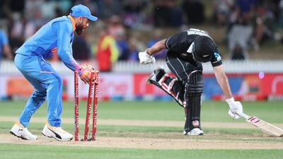 India’s Virat Kohli runs out New Zealand’s Colin de Grandhomme in Hamilton on Wednesday. AFP