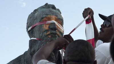Students defaced a statue of Cecil Rhodes at the University of Cape Town. Rodger Bosch / AFP