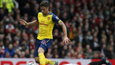 Manchester United’s Phil Jones tackles Arsenal’s Olivier Giroud with his head. Phil Noble / Reuters