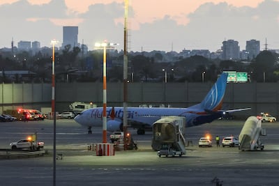 Flydubai's repatriation flight sits on the tarmac after landing in Tel Aviv. Reuters