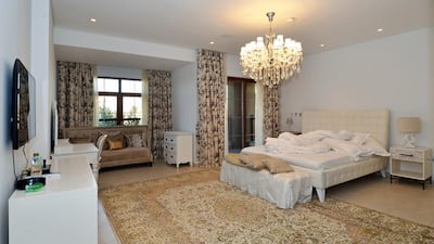 Above, one of the five bedrooms in this Dh20 millon villa at Jumeirah Islands’ Mansions. Courtesy Better Homes
