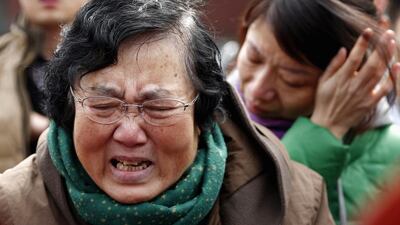 A swarm of security closely watched the relatives and stopped them from entering the sprawling grounds. Kim Kyung-Hoon / Reuters