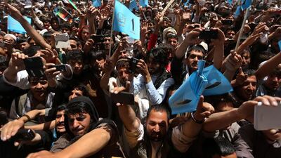 Supporters of Afghan presidential candidate Abdullah Abdullah attend his election campaign gathering in Paktiya province on May 24. The second round presidential election will be held on June 14. Omar Sobhani / Reuters