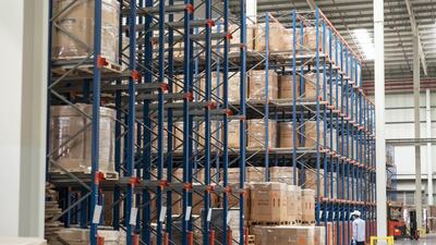 Stacks of boxes of raw materials are stacked in Mai Dubai's largely automated factory floor. Antonie Robertson/The National