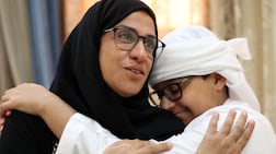 Mariam Kouraichi and her 13-year-old son Zayed. Photo: Chris Whiteoak / The National