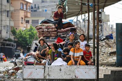 Palestinians flee the area of Tal Al Sultan in Rafah with their belongings following renewed Israeli strikes in the city in the southern Gaza Strip. AFP