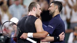 Jack Draper, left, and Novak Djokovic embrace after their match at Indian Wells. AFP