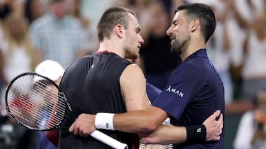 Jack Draper, left, and Novak Djokovic embrace after their match at Indian Wells. AFP