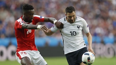 France striker Andre Pierre Gignac, right, tussles with Switzerland defender Johan Djourou. Carl Recine / Reuters