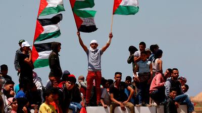 Palestinian demonstrators gather east of Khan Yunis in the southern Gaza Strip during a protest marking 71th anniversary of 'Nakba'. AFP