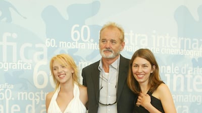 Scarlett Johansson, in a white dress and pink Converse, Bill Murray and Sofia Coppola at the 60th Venice Film Festival on August 29, 2003 in Venice, Italy. Getty Images