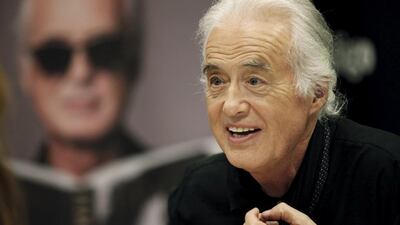 British rock musician and former guitarist for Led Zeppelin, Jimmy Page smiles at fans in Toronto (REUTERS/Hans Deryk)