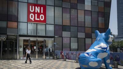 A pedestrian walks past a Uniqlo store, operated by Fast Retailing Co., in the Sanlitun area in Beijing, China. The Chinese economy returned to growth in the second quarter, marking an important milestone in the global struggle to recover from the coronavirus pandemic. Bloomberg