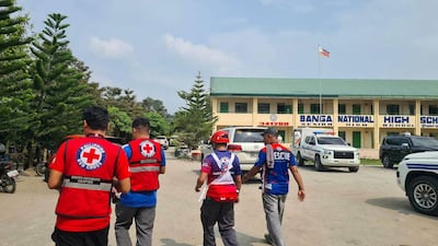 Emergency personnel walk at a site of a deadly shooting at a school in Banga, South Cotabato, Philippines, September 18, 2026. Reuters