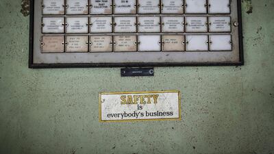 A sticker is seen next to a panel in the control room of the abandoned former Union Carbide Corp pesticide plant in Bhopal.