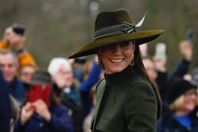 The Princess of Wales smiles at crowds of well-wishers as she heads to a Christmas Day church service. Reuters