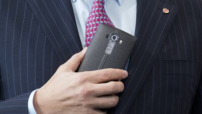 Juno Cho, president and CEO of LG , holds the LG G4. Mark Lennihan / AP Photo