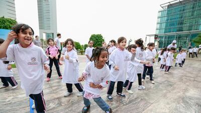 Kids join the combat aerobics exercises at Dubai’s International Financial Centre. Victor Besa for The National