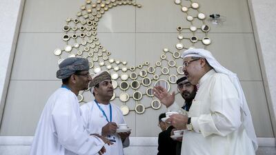 Delegates from Oman and the Bahrain share insights during a break at the International Renewable Energy Agency assembly. Silvia Razgova / The National