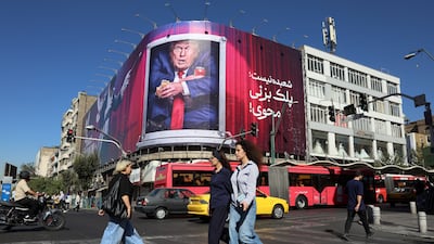 An anti-Trump billboard looms over a street corner in Tehran. Oil prices have been trading lower this week on the prospect of a breakthrough to end the Iran war. EPA