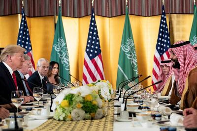 US President Donald Trump listens while Saudi Crown Prince Mohammad Bin Salman Al Saud speaks before a working breakfast during the G20 Summit in Osaka on June 29, 2019. AFP