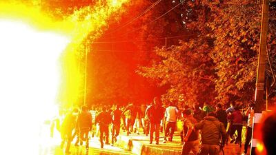A tear smoke canister explodes as Police chase employees of Public Health Engineering (PHE) department during a protest march in Srinagar. Farooq Khan / EPA