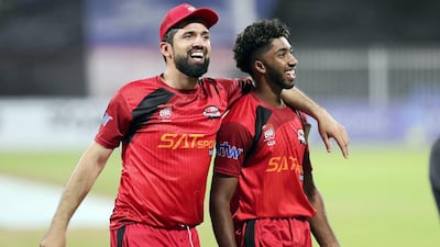 Sharjah's Vriitya Aravind celebrates victory with Rohan Mustafa. Chris Whiteoak / The National
