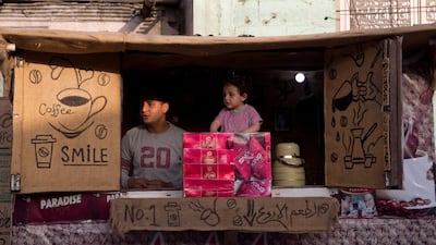 A Palestinian youth sells cigarettes at the beach, in Gaza City. AP Photo
