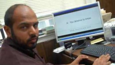 Azeem Khan, the Islamic Circle of North America spokesman, shows an advert for a website that answers general questions about Islam.