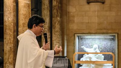 Father Henry offers his morning sermon to his congregation of largely Filipino worshipers.Finbar Anderson for The National