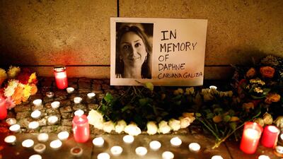 Candles burn to commemorate the killed investigative journalist Daphne Caruana Galizia in Berlin, Germany, October 20, 2017. REUTERS/Axel Schmidt