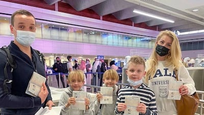 A family shows off their new stamps.