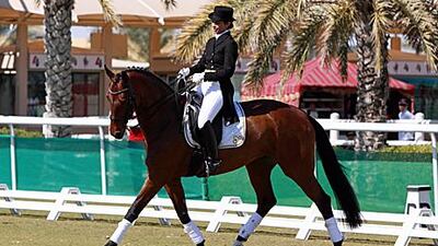 Farah al Khojai riding her horse Donna Bellissimia prior to competing in the Asian Games.