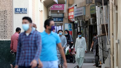 Residents of Naif pictured after the district's lockdown was lifted in late April. Police patrolled the streets for a month to ensure cases in the high density area did not spread. Pawan Singh / The National