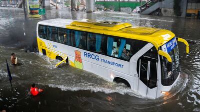 A bus surges along a flooded road following heavy rains brought by Typhoon Gaemi to Manila. Reuters