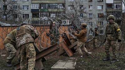 Ukrainian soldiers set up a barricade in Bakhmut. AP