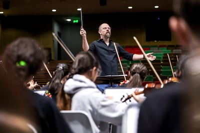 NYO conductor Jonathan Barrett likens the tenets of music education to important life lessons. Victor Besa / The National