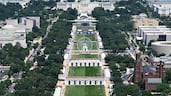 The Ferris wheel of the Great American State Fair in the National Mall viewed from the Washington Monument with the US Capitol in the distance. The fair celebrates the 250th anniversary of the US Declaration of Independence. AFP