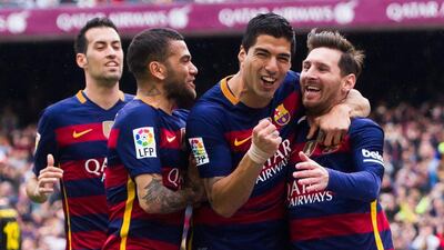 Luis Suarez, second right, and his Barcelona teammates celebrate duringthe 5-0 win over Espanyol. Alex Caparros / Getty Images