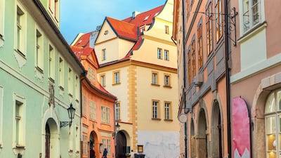 Shop at the tiny boutiques in the narrow cobblestoned streets surrounding Prague's Old Town Square. Alamy