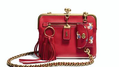 Coach: Small and cute, the scarlet tone of this Kisslock bag is given a playful twist with a cartoon duck motif.
