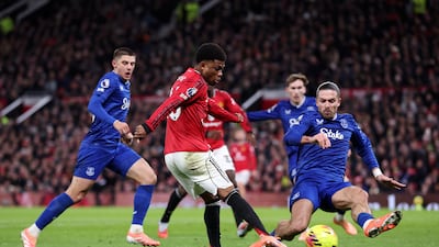 Amad Diallo of Manchester United shoots whilst under pressure from Jack Grealish of Everton. Getty Images