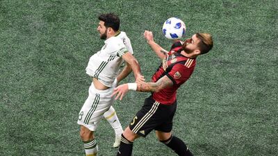 Atlanta United's Leandro Gonzalez Pirez goes up for a header against Portland Timbers' Diego Valeri. Reuters