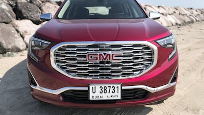 The Terrain is distinguished by apostrophe-shaped headlights and the trademark big, brooding GMC grille. Reem Mohammed / The National