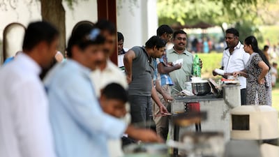 The busy barbecue area of Safa Park on the first day of Eid. Pawan Singh / The National
