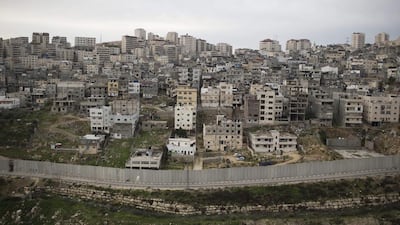 A view of the Shuafat Palestinian refugee camp of surrounded by the Israeli barrier (Separation wall). Palestinian officials have submitted a draft resolution to the UN Security Council that would set a two-year deadline to end Israeli occupation. EPA/ABIR SULTAN Abir Sultan / EPA