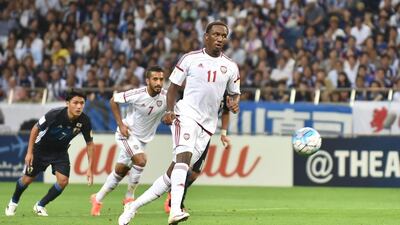 UAE forward Ahmed Khalil scores a penalty kick against Japan during their football match in the final round of Asian qualifiers for the 2018 World Cup at Saitama Stadium on September 1, 2016. Kazuhiro Nogi / AFP